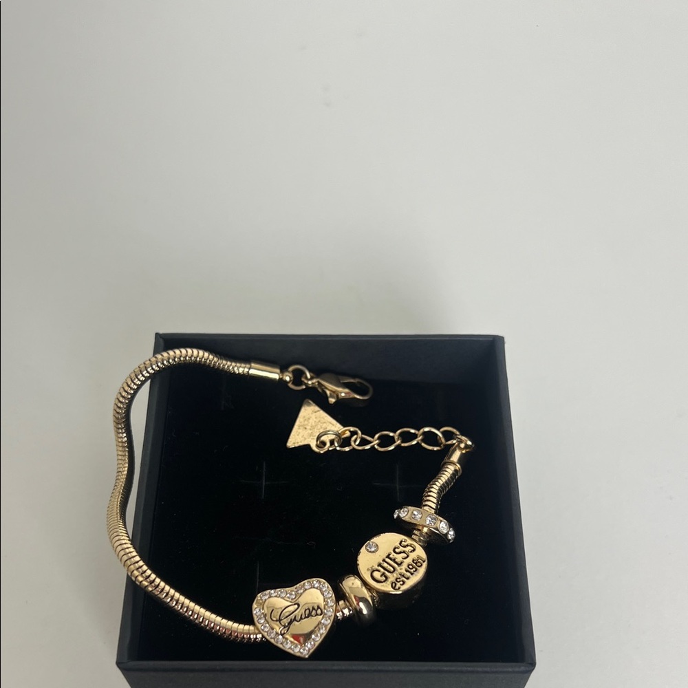 Guess Gold Bracelet with Heart and Logo Charms